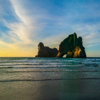 Zonsondergang bij Wharariki Beach